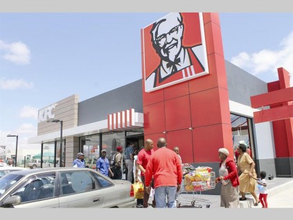 People rush to grab some KFC at the new Seshego KFC in the Seshego Circle Centre, that officially opened last Wednesday.