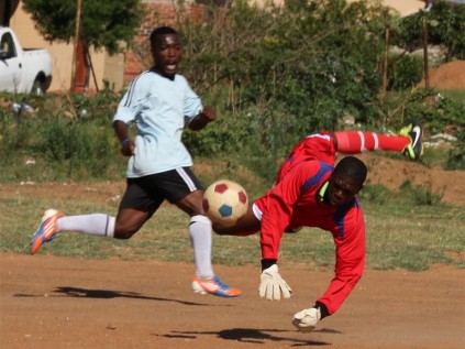Dynamics FC goalkeeper, Mashila Baloyi, pulls off a great save to deny Kgabo FC's, Oscar Mashila, a goal during the first semi-final match of the Top4 tournament.