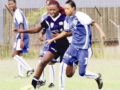 Developmemt FC's Maggy Madiba and Morole Thete of Kanatla Ladies FC struggle for ball possession during their first league match of the season, where Kanatla won 8-1.