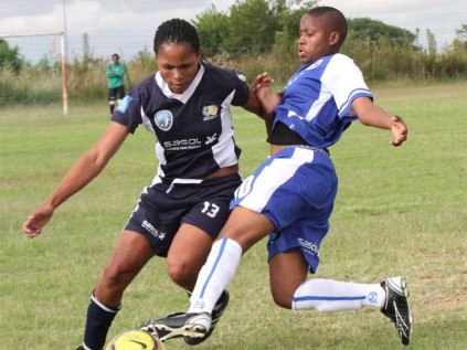 Jeanet Fischer of Kanatla Ladies FC dribbles past Mpho Dinake of Development FC.