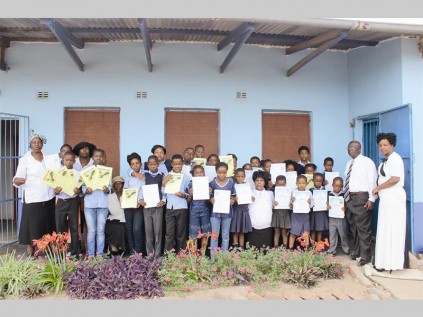 Learners from Nkoana Primary School who were awarded for excellent performance show off their certificates during the awards ceremony, which was held on Thursday.
