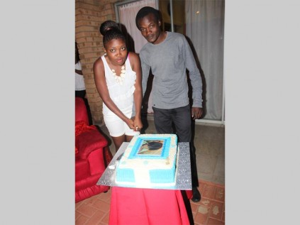 Leah Maphatane and George Maphatane cut the cake during Leah's 21st birthday celebration in Bendor.