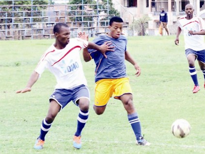 Itumeleng Seshweni of Dynamics FC, uses his strength to take control of the ball ahead of Maradona Masemola of FC Zamalek.
