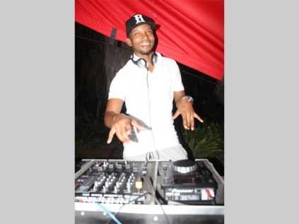 DJ Thembe spins the disc during the all white party at Airport Africa Lodge in Polokwane on Saturday.
