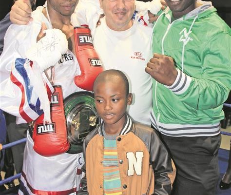 The SA featherweight champion, Oscar Chauke with Mamy Fernandes (trainer), Driver Mathonsi (friend) and Nhlamulo Chauke (family member) after he won the fight against Prince Ndlovu.