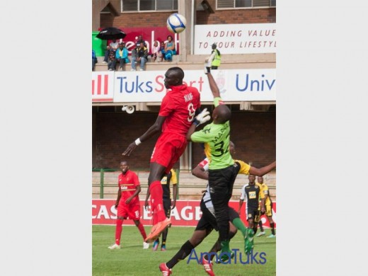 Photo: SuppliedFormer Black Leopards goalkeeper, Azwindini Maphaha, punches the ball away from the danger zone during their clash against Pretoria University FC.